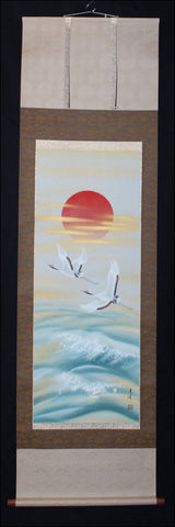 Sun, cranes and ocean
